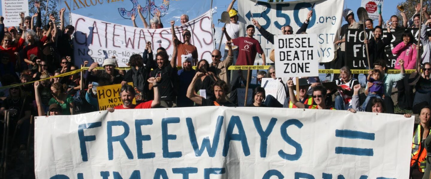 Demonstration with Freeways = Climate Crime banner
